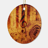 Pianotoetsen met muzieknotities en roos keramisch ornament (Links)