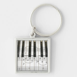 Pianotoetsenbord en -Muzieknoten Sleutelhanger