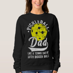 Pickleball vader als een tennis vader maar met gro trui