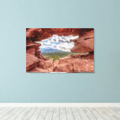 Pikes peak through a Rock Hole Canvas Afdruk (Insitu (Houten vloer))