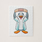 Pinguïn als arts met gips legpuzzel (Verticaal)