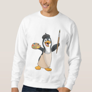 Pinguïn als schilder met penseel en kleur verf trui