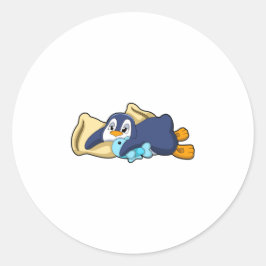 Pinguïn bij slapen met piloot ronde sticker