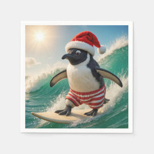 Pinguïn die met Kerstmis surft op een oceaangolf Servet