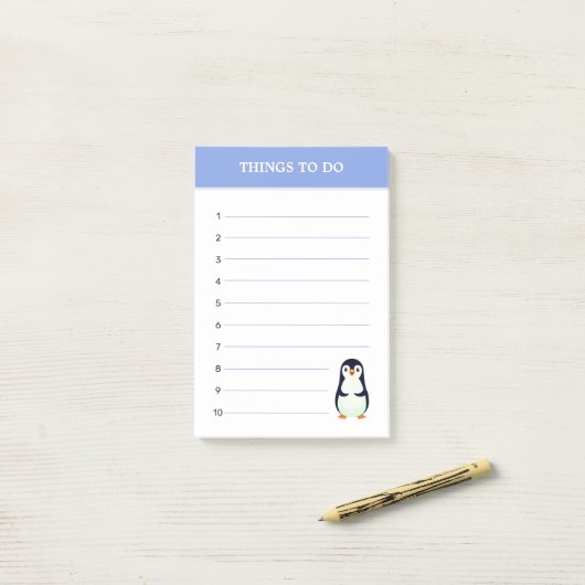 Pinguïn en bewerkbare dingen om opmerkingen te mak post-it® notes (Op bureau)