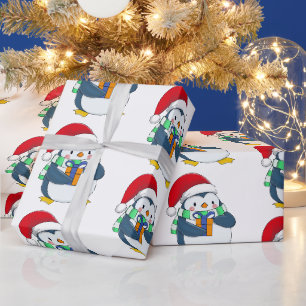 Pinguïn in een kerstpet met cadeau cadeaupapier