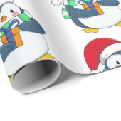 Pinguïn in een kerstpet met cadeau cadeaupapier (Rol Hoek)
