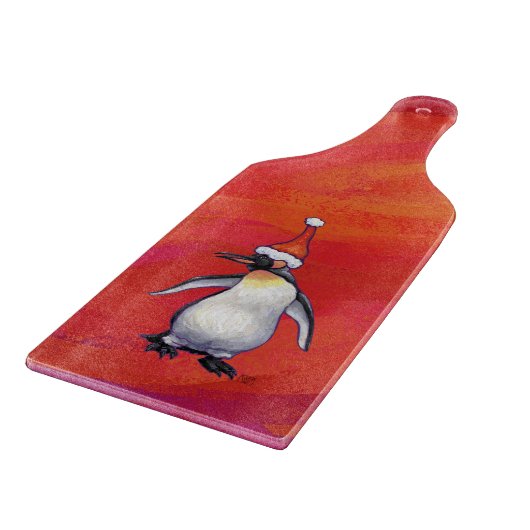 Pinguïn in Santa Hat op rood Snijplank (Hoek)