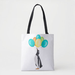Pinguïn met kleurrijke ballonnen tote bag