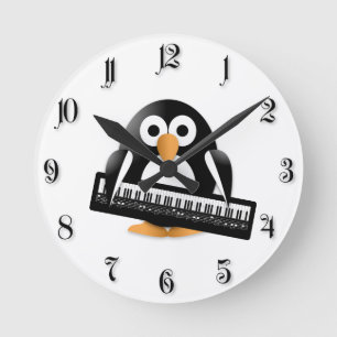 Pinguïn met piano ronde klok