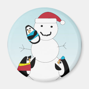 Pinguïns bouwen een sneeuwpop in de winter magneet