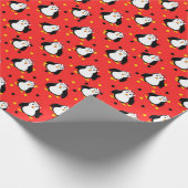 Pinguïns in kerststemming op rood cadeaupapier (Hoek)