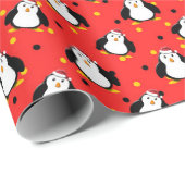 Pinguïns in kerststemming op rood cadeaupapier (Rol Hoek)