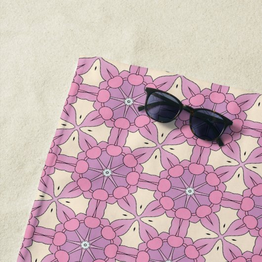 Pink and white geometric mandala patterned strandlaken (In situ)
