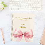 Pink bow beige cream inspirational quote 2026 planner<br><div class="desc">A soft beige,  cream colored background,  decorated with a large pink bow.  Quote: Live with intention.  The future is written by those who dare to plan.</div>