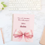 Pink bow quote 2026 planner<br><div class="desc">A soft blush pink background,  decorated with a large bow.  Quote: Live with intention.  Plan with purpose.</div>