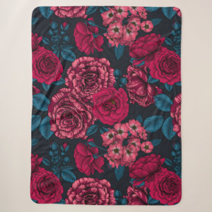 Pink, red and bi-color roses with blue leaves on b sherpa deken