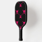 Pink skull and crossbones on black pickleball paddle (Links)