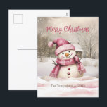 Pink Snowman Vintage Christmas Briefkaart<br><div class="desc">Deze kleine sneeuwman heeft de mooiste glimlach terwijl hij geniet van zijn besneeuwde winter. "Vrolijk kerstfeest". Hij is zo mooi gekleed in een vakantie roze gebreide pet en geringde sjaal. Dit is een waterverf met alle bewerkbare tekst op de voorkant van dit briefkaart. Zorg ervoor dat u de voorbeeldnaam en...</div>