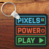 Pixels Power Play Keychain – Retro Gamer Accessory (Voorkant)