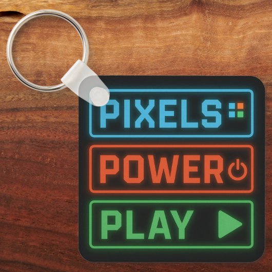Pixels Power Play Keychain – Retro Gamer Accessory (Voorkant)