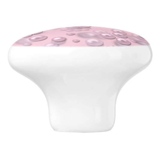 Plaatsers van wit-roze parels op roze fluweel keramische knop (Zijkant)