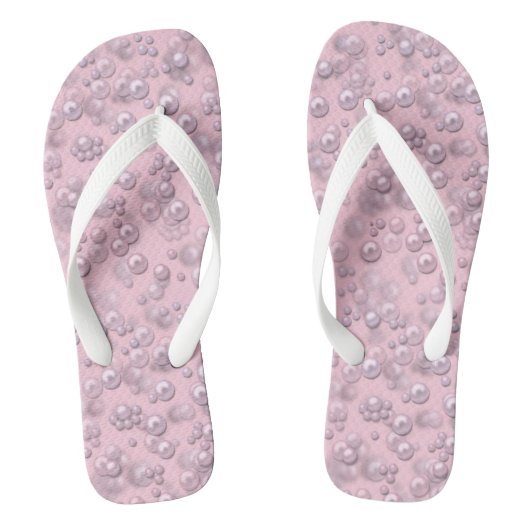 Plaatsers van wit-roze parels op roze fluweel teenslippers (Voetbed)