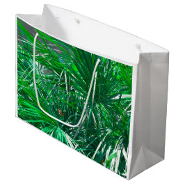Plant met groene palmboom verlaat pastel groot cadeauzakje
