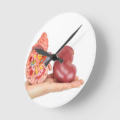 Platte hand met model voor de menselijke nieren ronde klok (Hoek)