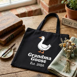 Playful Grandma Goose Est Year Cute Goose Caracter Tote Bag<br><div class="desc">This tote bag features the phrase “Grandma Goose Est Year” alongside a charming goose illustration. The playful design draws inspiration from classic Mother Goose imagery while celebrating grandmotherhood in a lighthearted way. The Est Year text can be updated so the year reflects when the grandmother welcomes a new grandchild. The...</div>