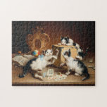 Playing Cards | Carl Reichert Legpuzzel<br><div class="desc">Playing Cards | Carl Reichert’s Playing Cards is a whimsical and delightful painting featuring three playful cats gathered around a table, seemingly engaged in an intense card game. The cats’ expressive faces and dynamic poses add humor and charm, while the finely detailed setting enhances the scene’s cozy and lighthearted atmosphere....</div>