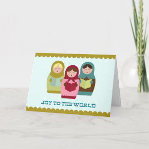 Plezier aan de wereld kerstkaart met matryoshkas feestdagen kaart