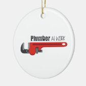 Plumber op het werk keramisch ornament (Links)