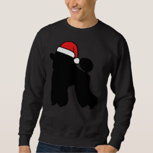 Poedel met een kerstmuts trui