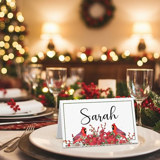 Poinsettia en holly met kardinalen kerst plaatskaartje