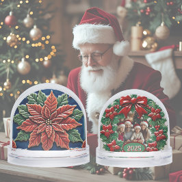 Poinsettia op blauwe kerst sneeuwbol