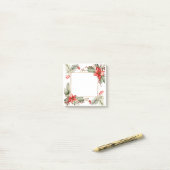 Pointsettia en de groenblijvende grens post-it® notes (Op bureau)