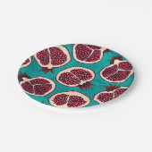 Pomegranaatplakken op turquoise papieren bordje (Gekanteld)