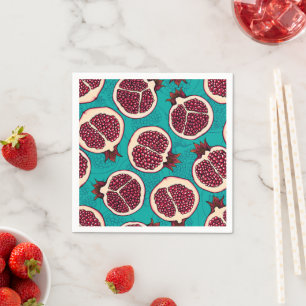 Pomegranaatplakken op turquoise servet