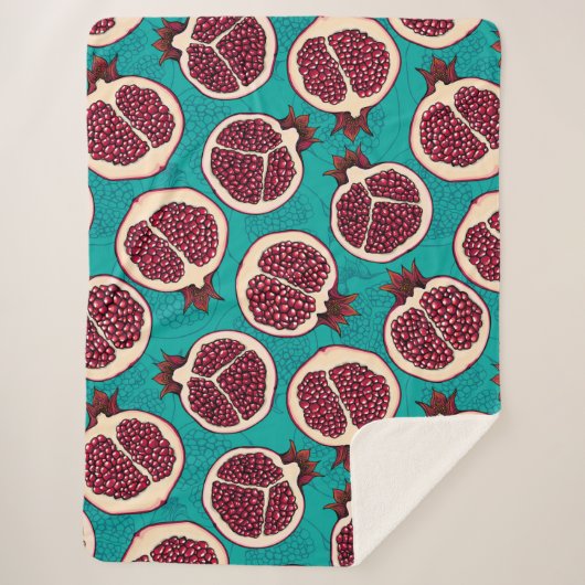 Pomegranaatplakken op turquoise sherpa deken (Voorkant)