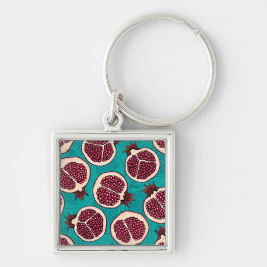 Pomegranaatplakken op turquoise sleutelhanger (Voorkant)