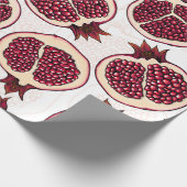 Pomegranaatplakken op wit cadeaupapier (Hoek)