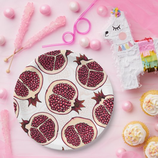 Pomegranaatplakken op wit papieren bordje (Feest)