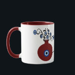 pomegranate with evil eye mug mok<br><div class="desc">Pomegranate in many cultures symbolizes abundance, blessing, fertility, and immortality. And the evil eye to ward of the negativity when you begin your day with a coffee in this unique mug.</div>