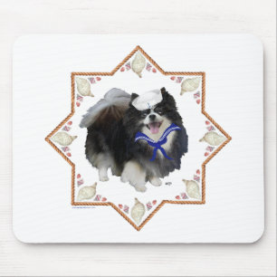 Pomeranian hond met schelpen muismat