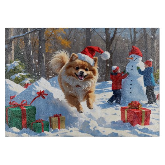Pomeranian rent in de sneeuw met kerstmuts snijplank (Voorkant)