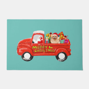 Pommerse Hond in Kerst Leveringsvrachtwagen Deurmat