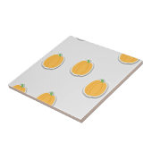 Pompoenen op grijs tegeltje (Zijkant)