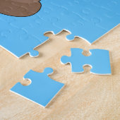 Poo emoji vliegt met ballonnen in blauwe lucht legpuzzel (Zijkant)