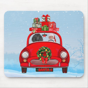 Poodelhond in auto met kerstman muismat